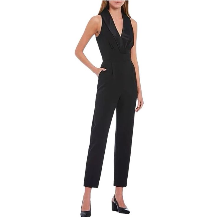 Nwot. Size 8. Color: Black. Sleeveless. Full Length Jumpsuit. Tuxedo Style. Slightly Tapered Pants. Pockets. Back Zipper Closure. Half Lined. Made Of Scuba Crepe Fabric Combo-Ed With Satin. 28 1/2” Inseam. Elegant Sleeveless Jumpsuits And Rompers For Night Out, Elegant Sleeveless Jumpsuits For Night Out, Elegant Sleeveless Bottoms For Night Out, Sleeveless Fitted Pantsuit For Party, Elegant Overall Pantsuit For Night Out, Sleeveless Pantsuit For Evening, Sleeveless Sleek Evening Pantsuit, Sleeveless Formal Pantsuit, Formal Stretch Jumpsuits And Rompers