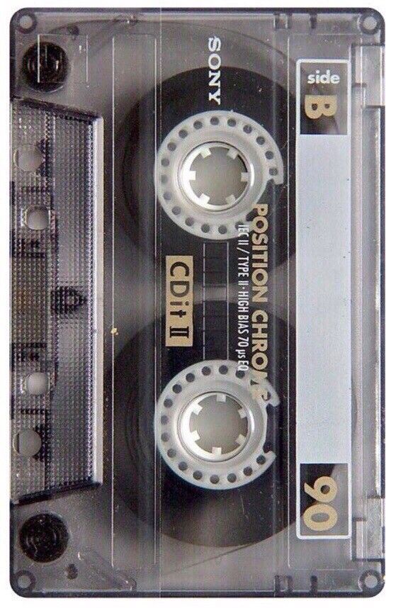 an old fashioned cassette with gold lettering on it