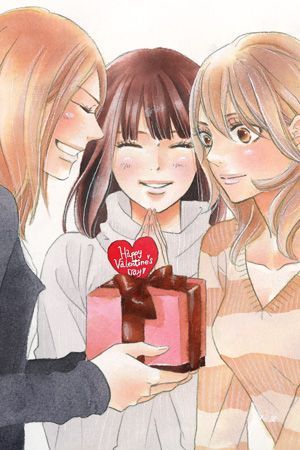 three girls are holding a box with a heart on it and one girl is wearing a sweater