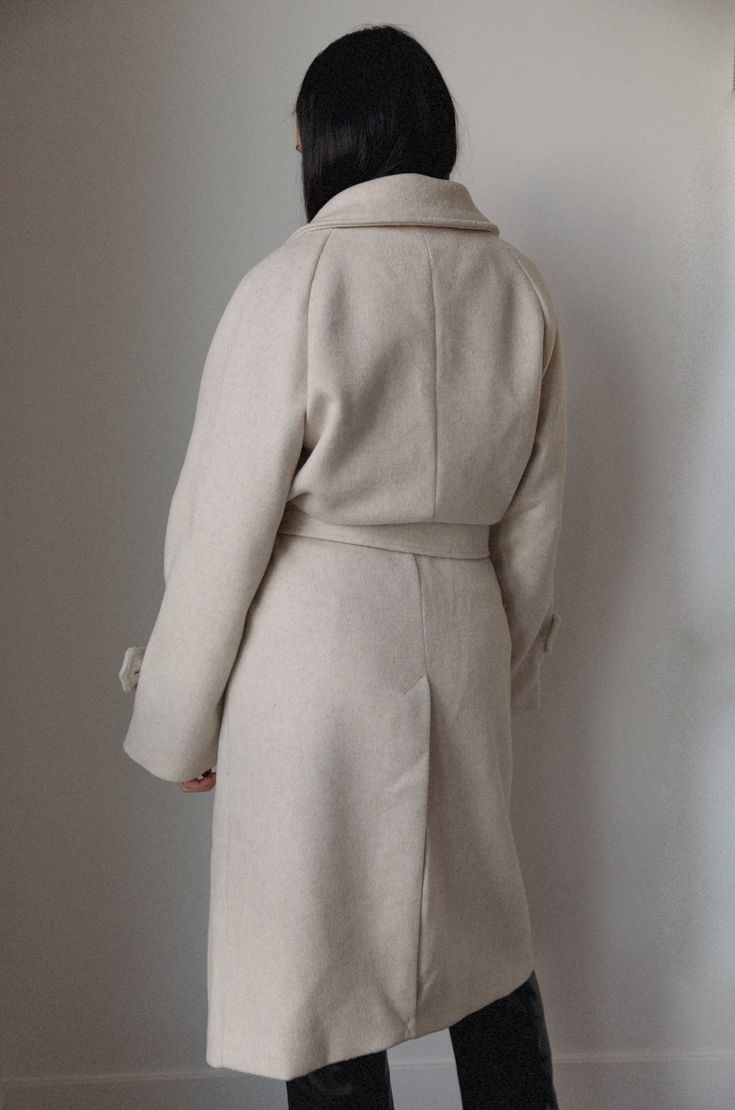 This belted wool blend coat is both stylish and luxe. Crafted from a wool blend in an oatmeal cream hue, it is fully lined for added warmth. Featuring an oversized collar, removable belt, and pockets, you'll stay cozy and chic in any weather. wrap style wide lapel collar buttoned tab on sleeve edge front welt pockets belted midi length lined hand wash self: 60% wool 40% polyester model is wearing a small Curvy Date Night Outfit, Air Clothes, Cream Coat, Oatmeal Cream, Valentines Day Dresses, Beige Coat, Oversized Collar, Thick Wool, Wrap Coat