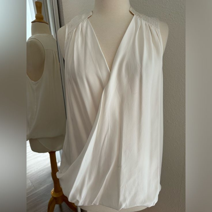 New Without Tags Chic Cream Tank Top, Chic Cream Tank Top For Vacation, Chic White Tank Top For Work, Chic Sleeveless Blouse Camisole For Vacation, Chic Tank Blouse For Daywear, Chic Sleeveless Camisole For Daywear, Elegant Tank Tops For Vacation, Chic White Tank Top For Beach, Elegant White Sleeveless Top