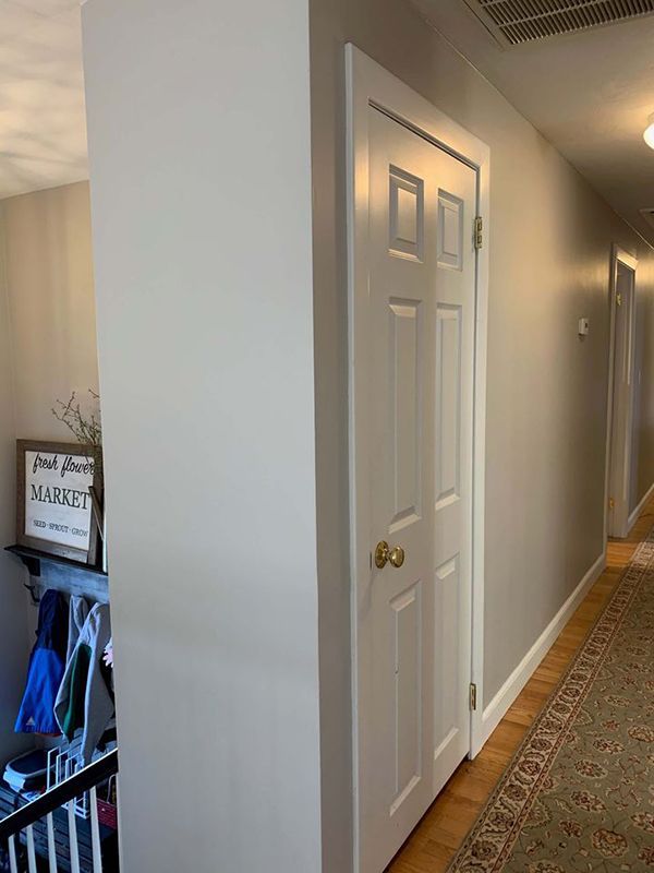 the hallway is clean and ready to be used as a storage area for shoes or other items