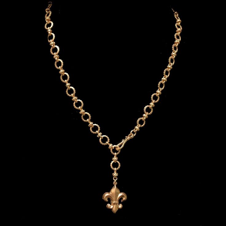 The Fleur de Lis Eternity Link Necklace can be adjusted to be worn as a choker, lariat or longer as a 22" necklace. It's the perfect layering piece with your other Whispering Goddess designs. Designed to be worn all day every day, it's extremely comfortable and versatile. The Fleur de Lis is 1" x 1" and the decorative link rings are 8mm. If you need it made longer or shorter, just notate it in the memo field at checkout. Available in Gold or Silver. Dainty Lariat Metal Necklaces, Adjustable Long Drop Necklace With Chain, Elegant Metal Charm Necklace With Lariat Shape, Classic Lariat Chain Jewelry, Adjustable Long Chain Drop Necklace, Gold Single Strand Lariat Necklace, Elegant Adjustable Medallion Necklace For Gift, Elegant Adjustable Medallion Necklace, Elegant Medallion Jewelry With Adjustable Chain