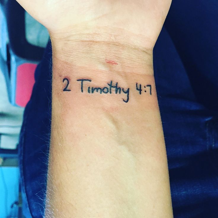 a person's wrist with the word twenty written in cursive writing on it