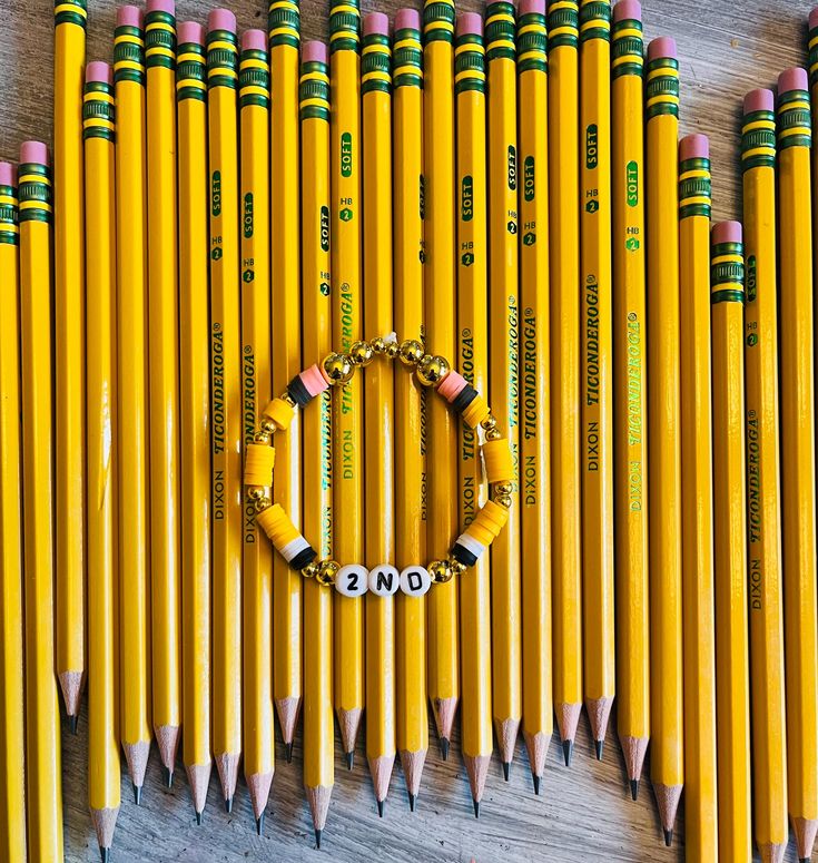 These bracelets make the perfect back-to-school gift or a fun surprise to add to the first day of school lunch! Each bracelet is custom-made with your choice of personalization. Bracelets are $5/each or $12 for three. (If purchasing three, use the Custom Set of Three listing.) Personalized Yellow Friendship Bracelets, School Spirit Letter Beads Bracelets Gift, Personalized Yellow Stretch Bracelet As Gift, Cute Personalized Yellow Bracelets, Customizable Adjustable Jewelry For School, Cute Personalized Craft Supplies For Back To School, Personalized Cute Craft Supplies For Back To School, Personalized Cute Craft Supplies For Teacher Appreciation, Personalized Pencil Craft Supplies For Gifts