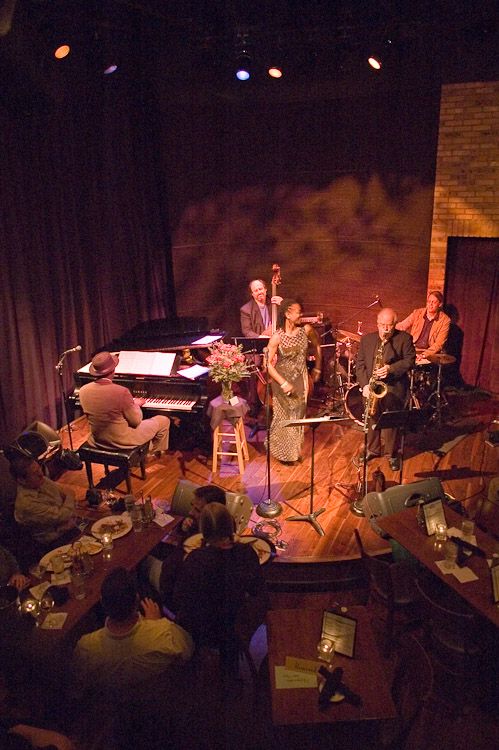 a group of people playing instruments on stage