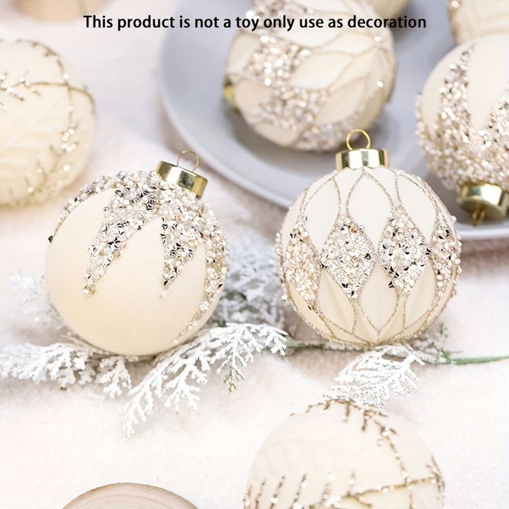 several white christmas ornaments on a table