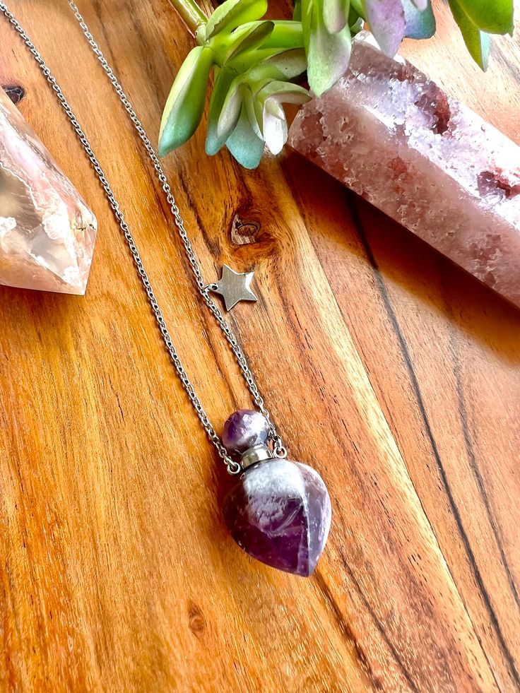 Our Amethyst Necklace is a wearable, healing talisman. Full of natural gemstones energies, it is the perfect piece to complement any outfit, with a natural, tropical and boho style to bring love, light, and healing into life. A stone for lovers, creatives, and pioneers. It promotes connectivity, spirituality, passion, and original thought, as well as temperance and sobriety. Zodiac sign: Aquarius, Pisces Use as Essential oils or perfume bottle necklace. Hair Locket, Cremation, Memorial, Urn, Ash Hair Locket, Bottle Necklace, Amethyst Necklace, Locket, Natural Gemstones, Essential Oils, Perfume Bottles, Boho Fashion, Amethyst