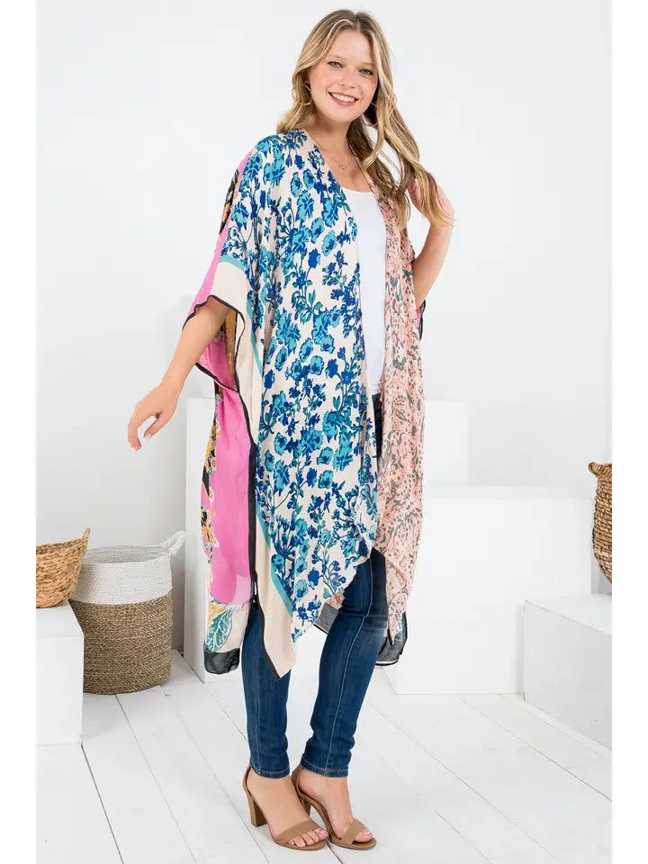 Experience the epitome of casual elegance with our Bohemian Floral Patch Print Kimono. Made from 100% viscose, it provides a soft, comfortable feel, perfect for resort or vacation wear. The missy fit suits a variety of body types, while the floral patch print adds a whimsical touch. Whether you're lounging poolside or exploring a new city, this kimono ensures you do it in style. 100% Viscose Casual Patterned Kimono For Beach Cover-up, Casual V-neck Kimono With Boho Print, Casual Multicolor V-neck Kimono, Casual V-neck Kimono For Loungewear, Free Size V-neck Kimono For Spring, Bohemian Rayon Kimono For Loungewear, Bohemian Style Rayon Kimono For Loungewear, Casual Rayon Kimono For Beach Cover-up, Flowy Kimono For Spring Loungewear