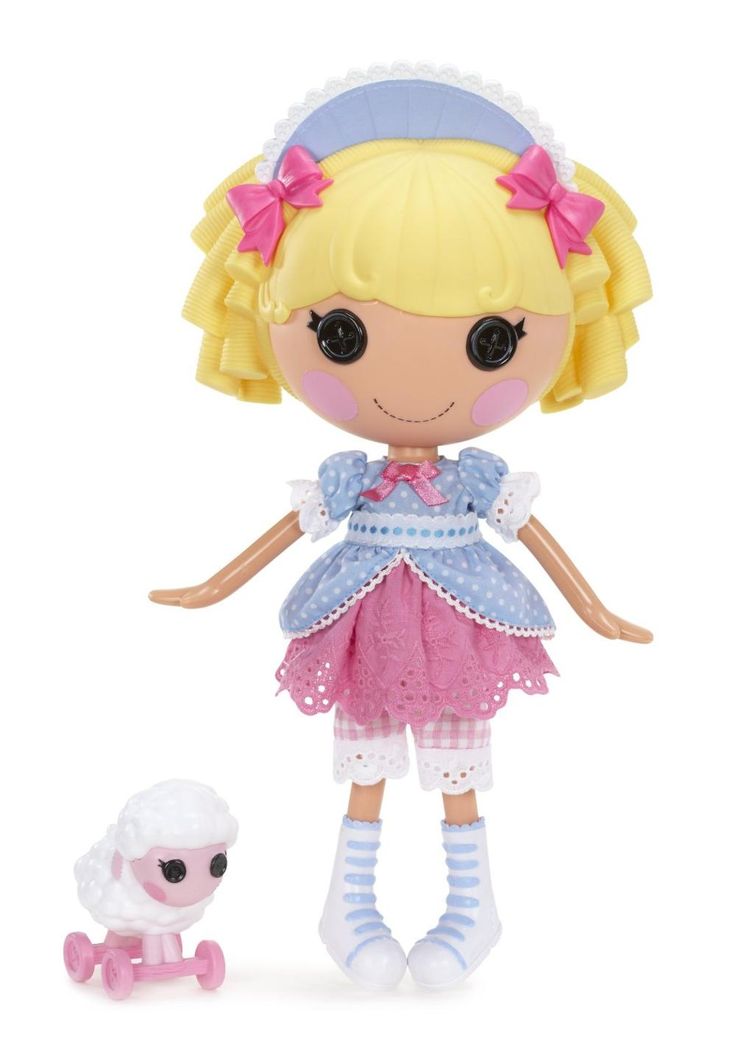 a doll and a small toy dog on a white background