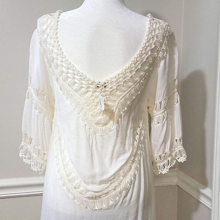 Nwt! Boutique Purchase Can Be Worn As A Swimsuit Cover Up, Tunic, Or Dress Beautiful White W/ Cream Colored Crochet Soft & Lightweight Cotton/Polyester Material Loose & Flowy Fit - Can Also Drape Off Of The Shoulders Deep V-Neck Elbow Length Bust - 36 In. Length - 37.5 In. (From Top Of Shoulder To Longest Part At Bottom) Note: One Tiny Gray Blemish At Bottom Left Hem In The Back (Not Visible Unless Dress Is Stretched Out Flat) - See Last Pic Elegant V-neck Lace Top For Beach, Cream V-neck Top With Crochet Trim, Elegant White V-neck Crochet Top, White V-neck Lace Top For Vacation, V-neck Lace Top With Lace Trim For Vacation, White V-neck Lace Top For Beach, Elegant Crochet Trim Top For Beach, Vacation Lace Trim V-neck Top, Cream Lace Top For The Beach