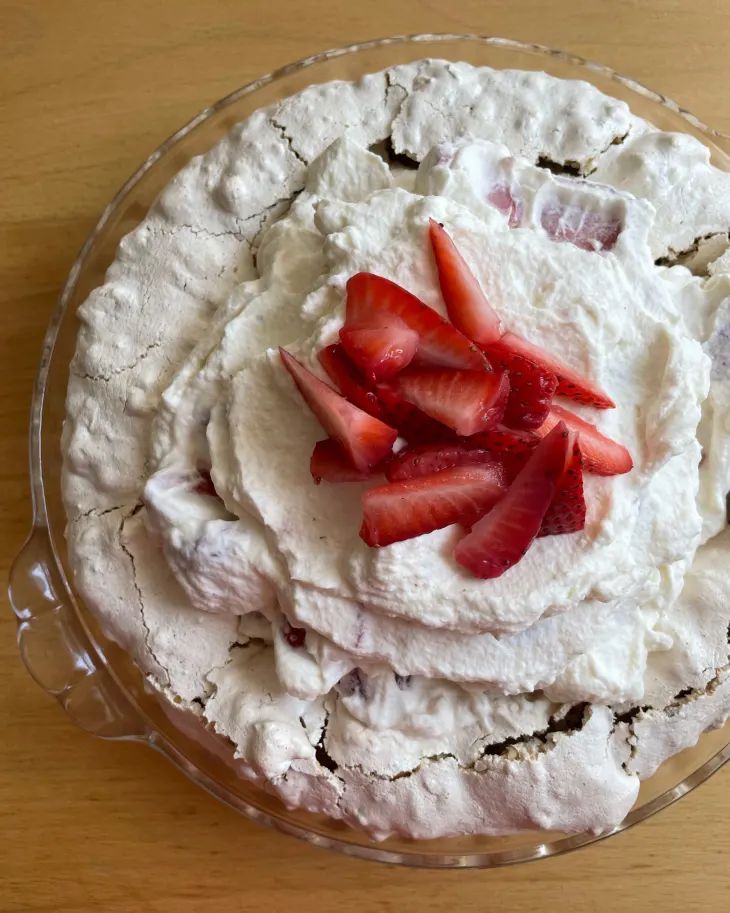 there is a pie with strawberries on top