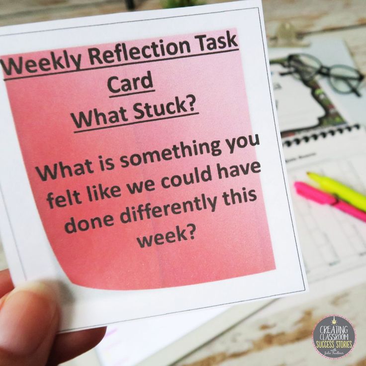 a hand holding up a pink sticky note with the words, weekly reflection task card what stuck?