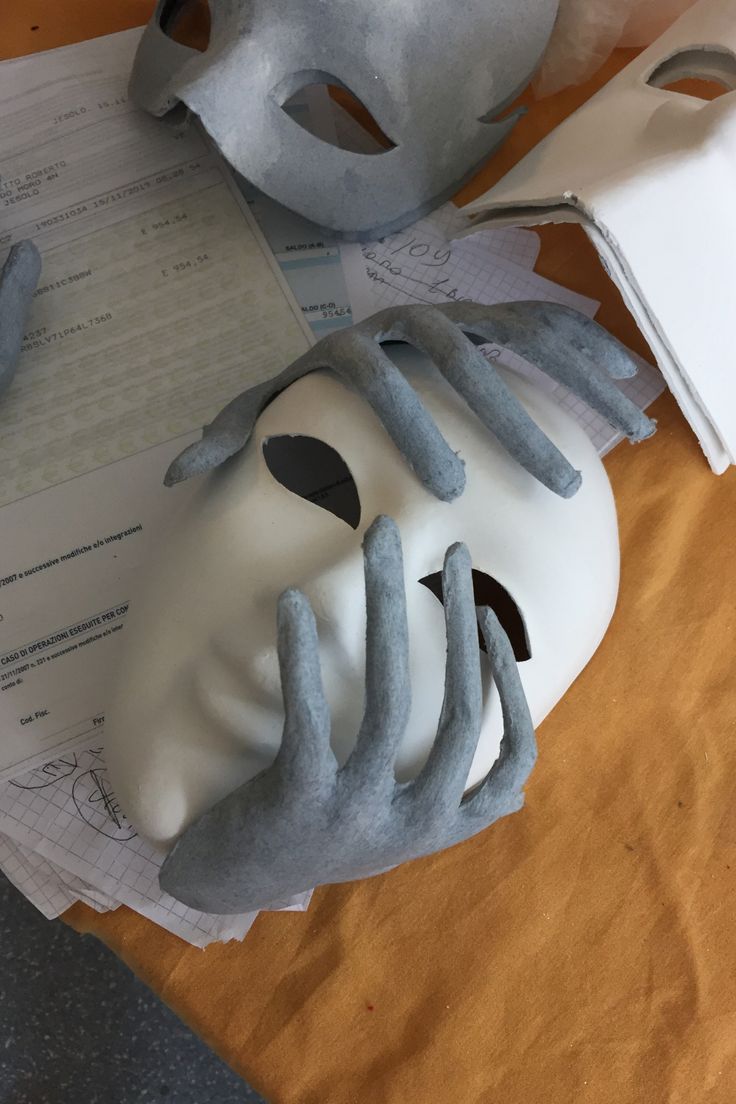 a mask sitting on top of a piece of paper