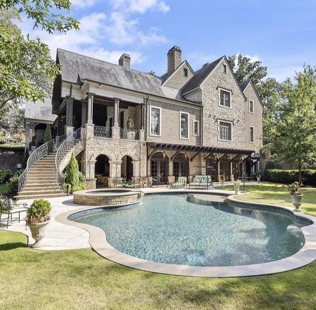 a large house with a pool in the front yard