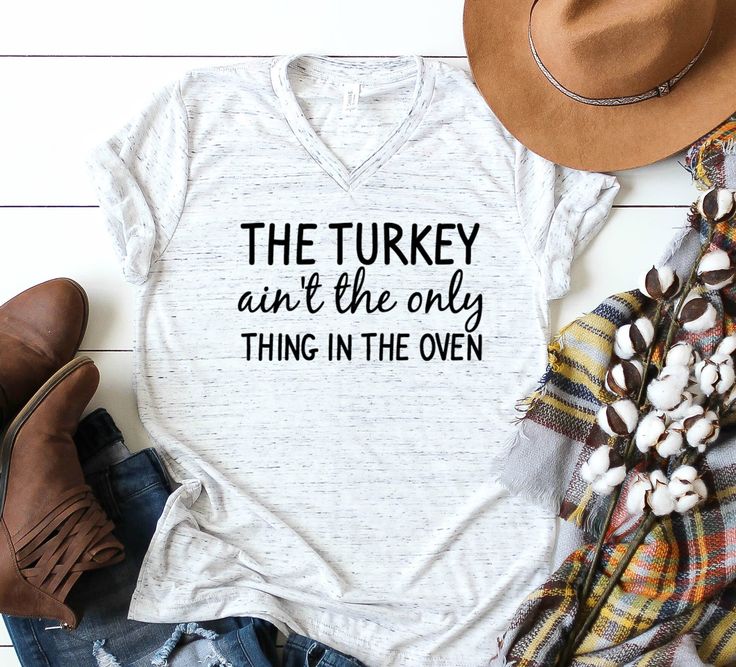 a t - shirt that says the turkey isn't the only thing in the oven