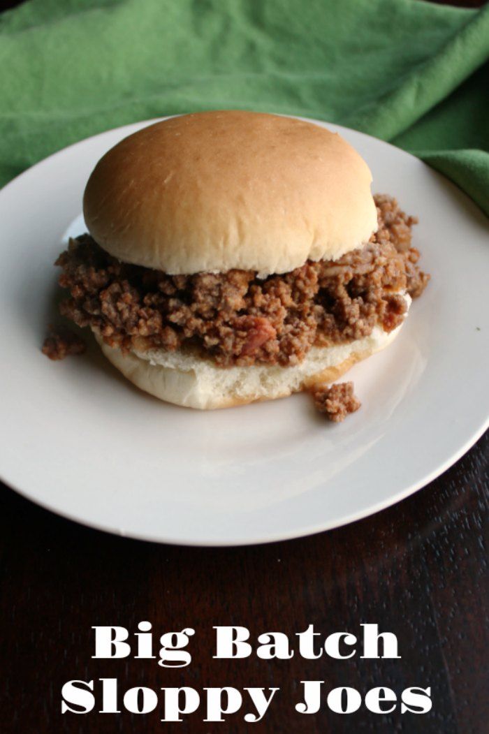 a sloppy joe sandwich on a plate with the words, big batch sloppy joes