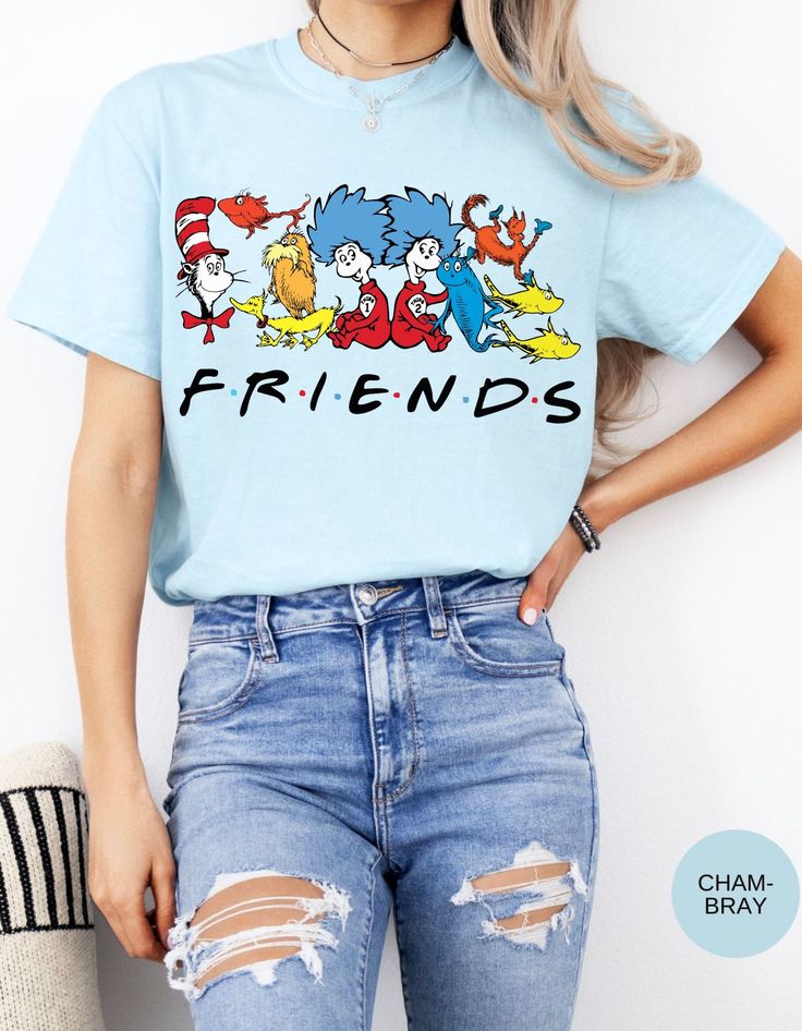 Join the whimsical world of Dr. Seuss with our Seuss Squad Friends Tee! Featuring beloved characters from the enchanting stories of Dr. Seuss, this shirt brings a splash of nostalgia and fun to your wardrobe. Made from soft, premium cotton, it offers all-day comfort and durability. Whether you're a lifelong fan or introducing these classic tales to a new generation, this tee is perfect for showing off your Seuss spirit. Ideal for casual outings, school, or cozy days at home, the Seuss Squad Friends Tee is a delightful addition to any Seuss lover's collection. Embrace the joy and magic of Dr. Seuss with this charming and colorful shirt! Themed Short Sleeve Top With Graphic Print, Themed Graphic Print Short Sleeve Tops, Trendy Relaxed Fit Shirt With Character Print, Themed Crew Neck Top With Character Print, Themed Character Print Crew Neck Top, Fun Cartoon Print Shirt With Relaxed Fit, Themed Cotton Crew Neck T-shirt, Fun Character Print Shirt For Spring, Cute Cartoon Print Tops For Fan Merchandise