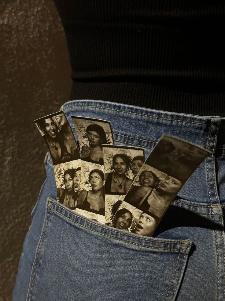 the back pocket of a woman's jeans with pictures of black women in them