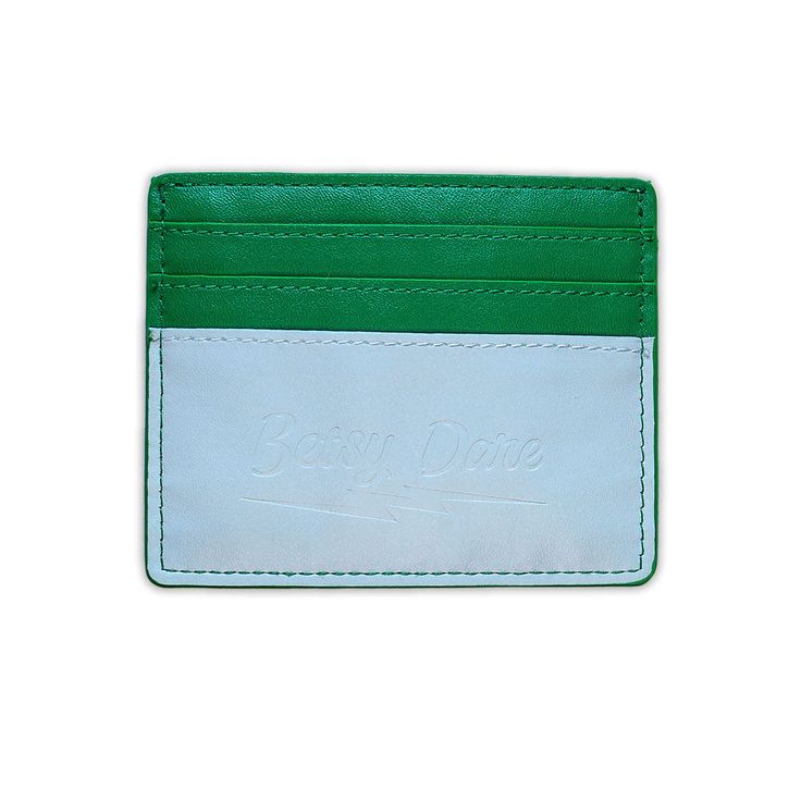 Our slim card wallet fits neatly in any of our bags to hold your cards and enough cash for a cover charge or a drag show. This combination of emerald green, jade, and mint creates a pop of color so vivid you'll outshine any jewels. Smooth vegan leather with contrasting lightning bolt appliqué Holds six cards 3.25" tall by 4" wide (8 cm x 10 cm) Drag Show, Gumball Machine, Green Jade, Lightning Bolt, Chain Strap, Card Wallet, Belt Bag, Emerald Green, Vegan Leather