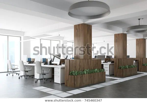 an office with three cubicles and two desks