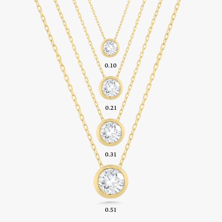 We know you'll love this necklace! A single diamond in a bezel setting floats on a glistening gold chain. This exquisite design is dainty enough to wear everyday yet shines for all to see. Available in three different carat weights, there is a size for everyone! Typically in stock and ready to ship within 1-3 business days. Metal: 18k White Gold / 18k Yellow Gold Round Brilliant Cut Natural Diamonds H Color and SI1-2 Clarity Diamonds Length: 17 inches with an adjustable sliding bead for versatil Formal Diamond Necklace With Smooth Bezel, Classic Necklace With Smooth Bezel, Classic Round Necklace With Smooth Bezel, Fine Jewelry Anniversary Necklace With Smooth Bezel, Minimalist Yellow Gold Solitaire Necklace With Smooth Bezel, Fine Jewelry Necklace With Smooth Bezel For Anniversary, Classic Anniversary Necklace With Smooth Bezel, Yellow Gold Solitaire Necklace With Vvs Clarity, Yellow Gold Necklace With Round Stone In Bezel Setting