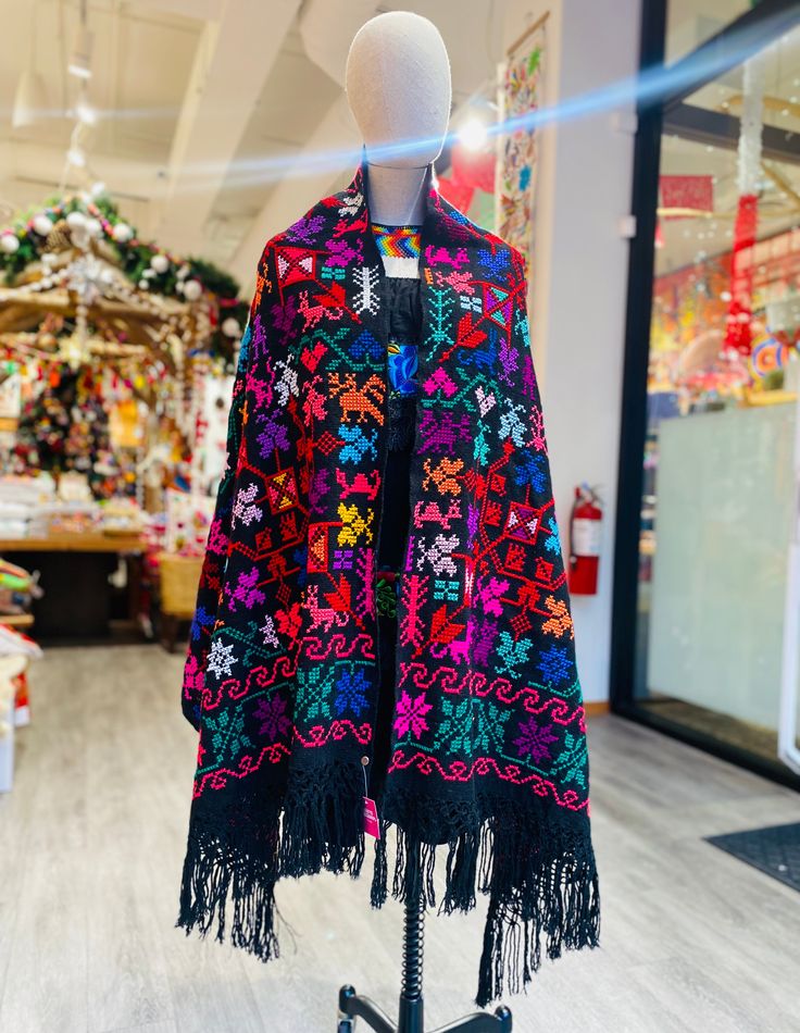 These incredible colorful rebozos are 100% cotton, hand-embroidered over 2 months with designs traditional to Hueyapan, Puebla: a mountainside Mexican town renowned for its embroidery. Embroidery details will vary on each piece (different types of flowers), but color scheme and central bird motifs are present on all. Multicolor Floral Embroidered Festival Shawl, Multicolor Floral Embroidered Shawl For Festival, Traditional Floral Embroidered Shawl For Winter, Traditional Winter Shawl With Floral Embroidery, Bohemian Multicolor Shawl With Embroidered Border, Bohemian Embroidered Multicolor Shawl, Bohemian Multicolor Embroidered Shawl, Bohemian Shawl With Intricate Multicolor Embroidery, Traditional Multicolor Embroidered Shawl For Winter