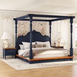 a blue four poster bed in a bedroom with hardwood floors and white walls, along with two lamps on either side of the bed