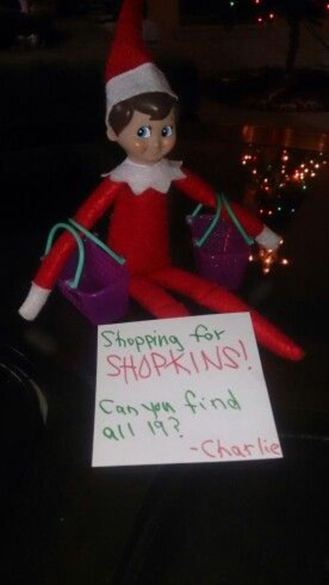 an elf is sitting on top of a car with a sign in front of him