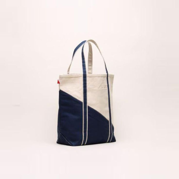 *Available for US customers only* Grab your keys, tickets, beach pass, and this great Contemporary Boat Bag! No matter where your travels take you, you can be fully prepared with all your essentials packed away in this classic navy striped tote. Perfect for air travel, road trips, sailing, train rides, amusement parks, beach days, hotel stays, pool days, lakeside afternoons, and family vacations. Artisan's Description: Our signatures with a twist of the contemporary diagonal sail design! Nothing Blue Bags For Weekend Trips, Blue Bags For Weekend Trips In Summer, Functional Rectangular Canvas Bag For Weekend Trips, Large Blue Travel Bag, Sail Colored Rectangular Travel Bag, Navy Rectangular Bags For Weekend Trips, Large Casual Canvas Travel Bag, Navy Everyday Tote Travel Bag, Canvas Beach Bag With Removable Pouch For Travel