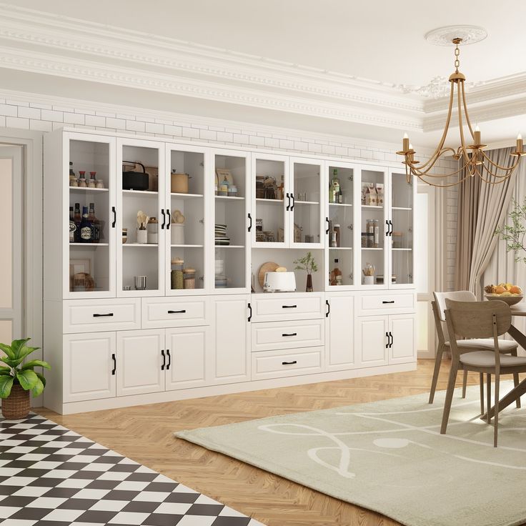 a dining room with white cabinets and black and white checkered rugs on the floor