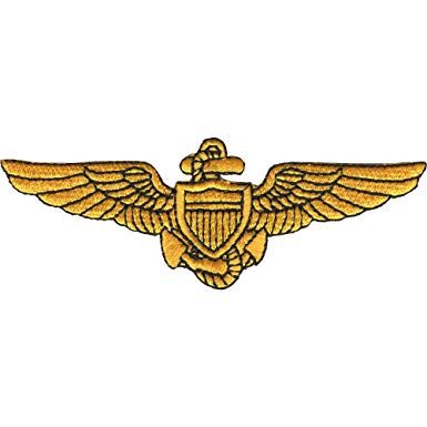 an embroidered gold eagle emblem on a white background