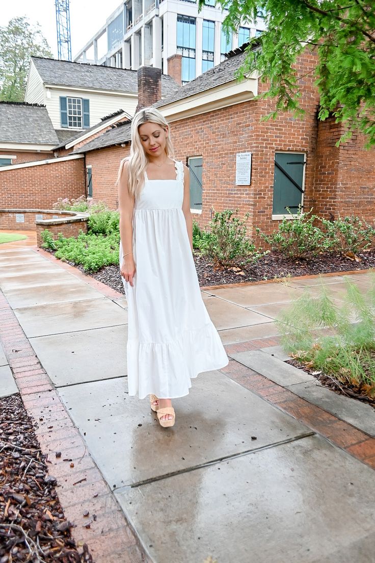 Our Ruffle Tie Back Maxi Dress features a midi/maxi length with a tiered bottom and a ruffle sleeve! She also has Pockets!! 55% Nylon, 45% Polyester Model is wearing a SMALL Run true to size! MODEL MEASUREMENTS: Top: XS-S Bottom: 00-0 Height: 5'2" Shoe Size: 6.5 Bra Size: 32B MADE BY: NEWBURY KUSTOM Flowy Midi Dress With Ruffled Straps For Day Out, Casual Ruffle Sleeve Maxi Dress For Garden Party, White Ruffle Sleeve Maxi Dress For Spring, Spring Midi Ruffle Dress For Day Out, Casual Ruffle Sleeve Maxi Dress For Day Out, White Casual Maxi Tiered Dress, White Casual Maxi Length Tiered Dress, Spring Brunch Maxi Dress With Ruffled Straps, Flowy Ruffle Midi Dress For Brunch