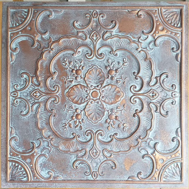 an old tin ceiling tile that has been painted silver