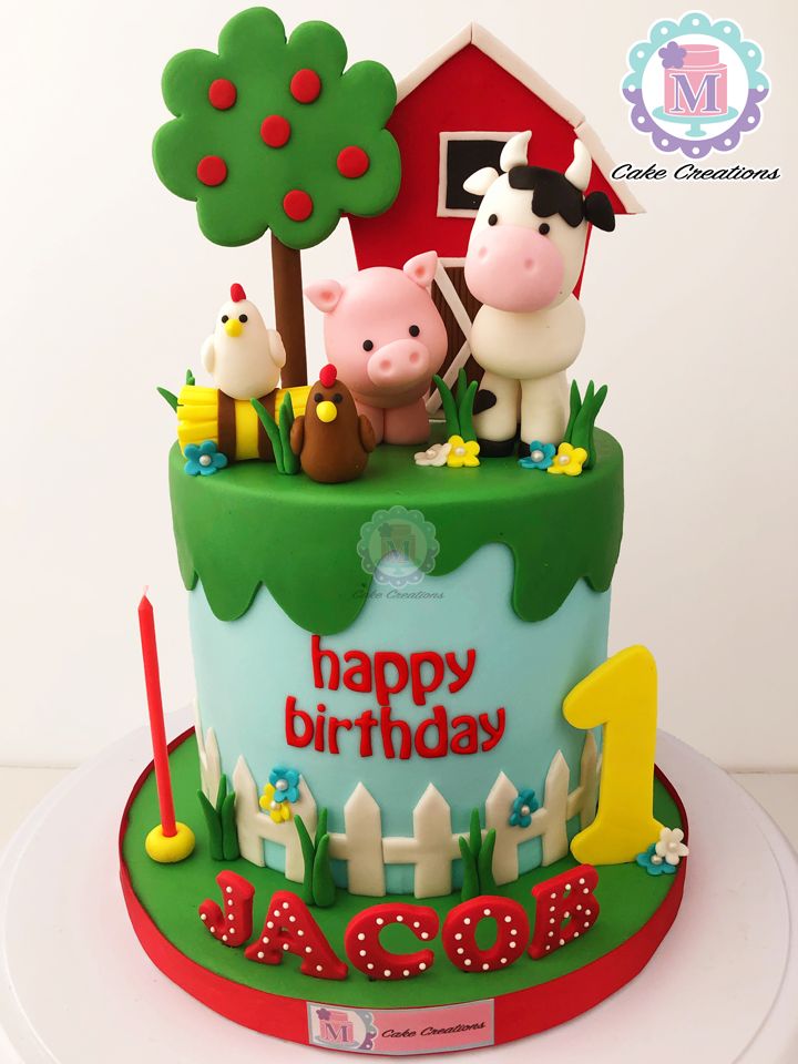 a birthday cake with farm animals on top