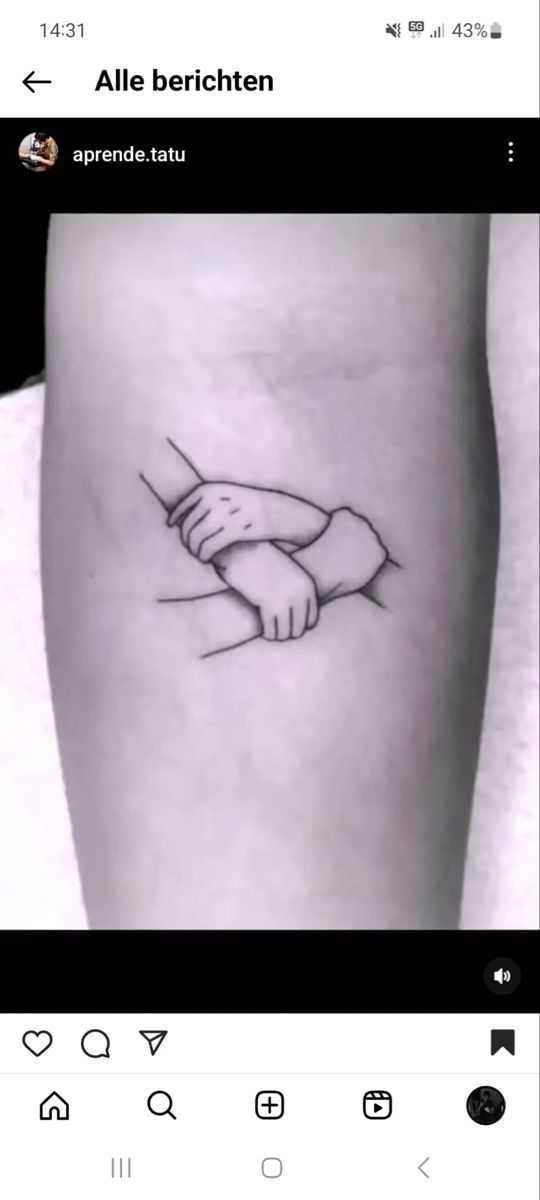 a tattoo on the side of a woman's leg with hands holding each other