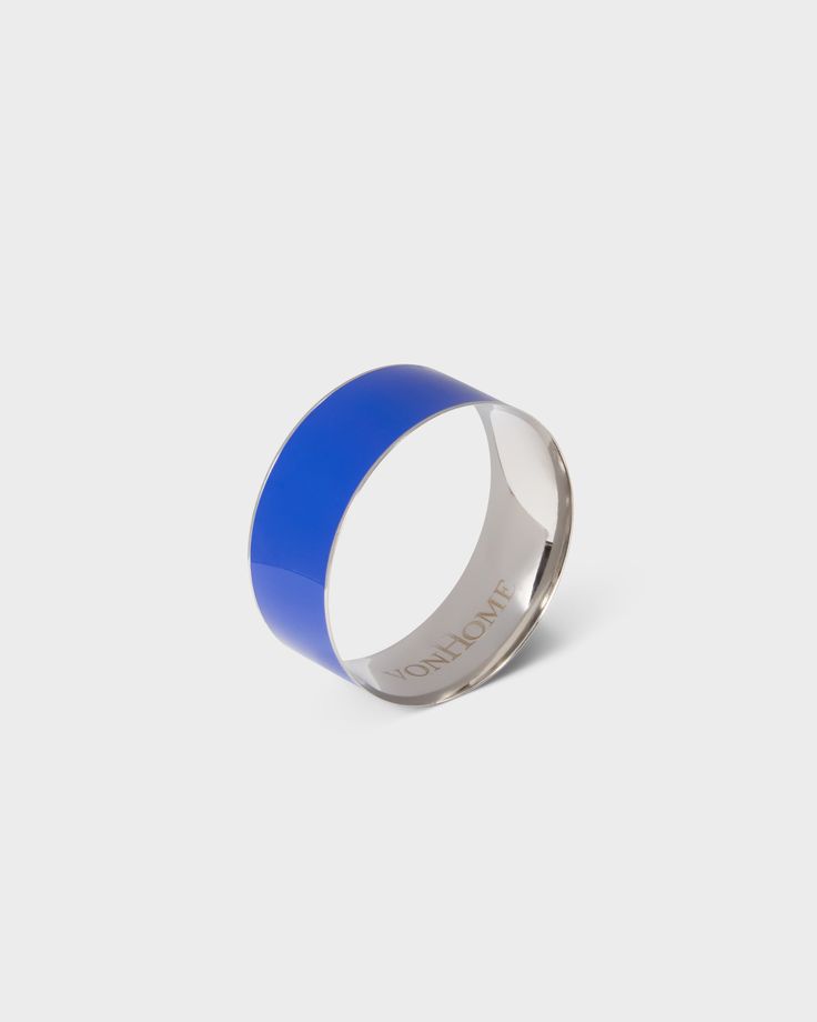 a blue and silver ring with the word love on it, against a white background