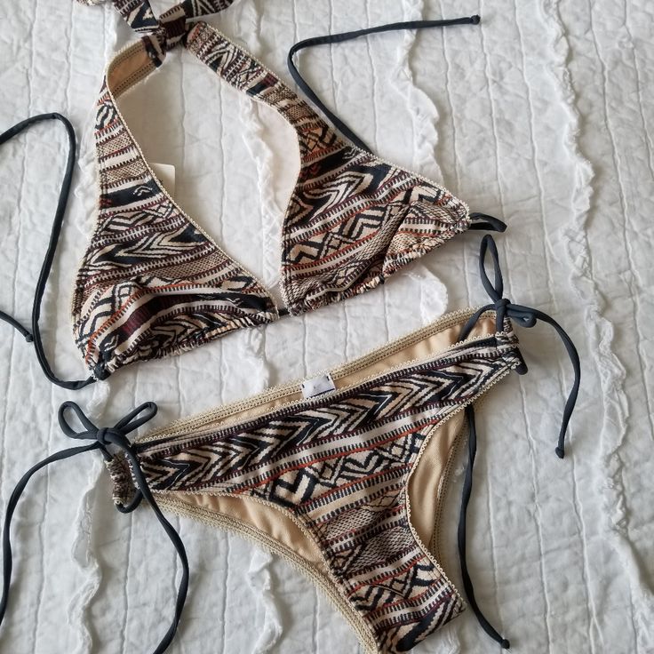 Martha Aponte Selena String Bikini. Size Small. Selena Safari Boho Print. This Designer Bikini Is Gorgeous! The Bottom Is Adjustable On The Sides. Both Top And Bottom Are Self Tie. Top And Bottom Are Included!! Fully Lined! Neutral Color Story! Brand New Tags Attached!! Sa Fitted Beige Halter Neck Swimwear, Beige Halter Neck Swimwear For Beach, Beige Swimwear For Beach Festival, Beige Halter Neck Swimwear For Beach Season, Fitted Beige Swimwear For Beach Party, Beige Triangle Top Swimwear For Beach, Beige Triangle Top Swimwear For Beach Season, Cream Beachwear Swimwear For Vacation, Summer Beige Halter Neck Swimwear