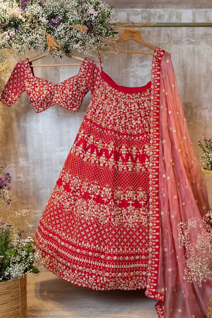 Arzoo features a fuschia reddish-pink raw silk floral and geometric patterned lehenga with a matching blouse and organza dupatta.by Chamee and Palak. DELIVERY TIMEPlease allow 8-12 weeks for your outfit to arrive. FABRIC DETAILSRaw silk, Organza Red Raw Silk Anarkali Set For Navratri, Festive Red Silk Anarkali Set, Designer Red Dupatta, Transitional Red Lehenga With Sheer Dupatta, Transitional Season Red Raw Silk Sets, Red Silk Sharara With Dori Work, Red Silk Anarkali Set With Dori Work, Transitional Red Raw Silk Sets, Red Chanderi Salwar Kameez For Reception