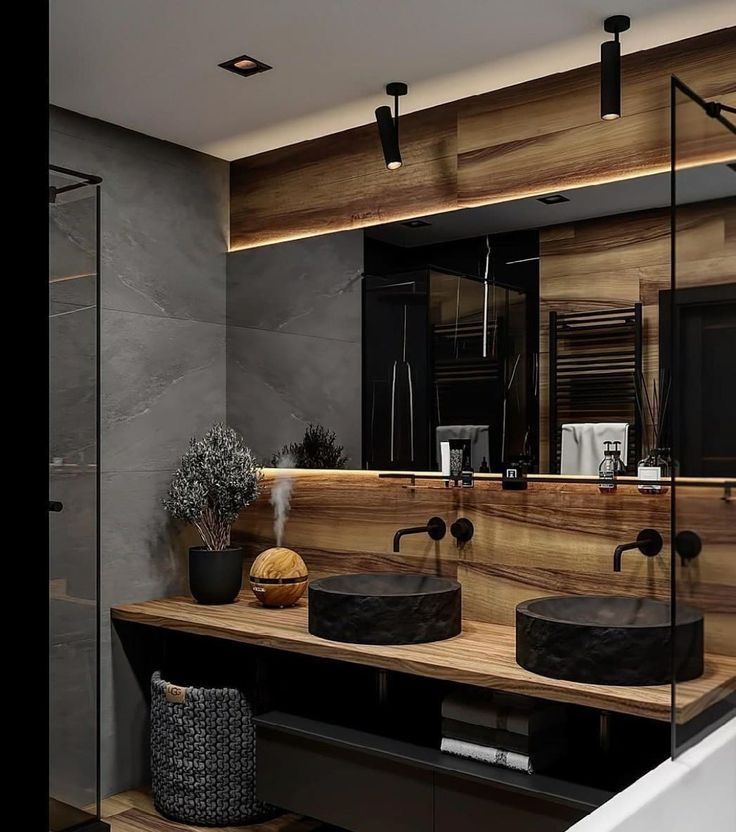 a bathroom with two sinks and a bathtub