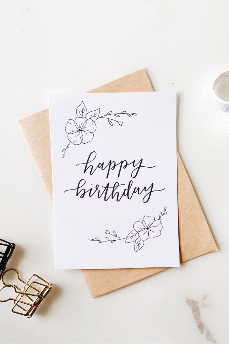 a card with the words happy birthday on it next to some glasses and a pair of eyeglasses