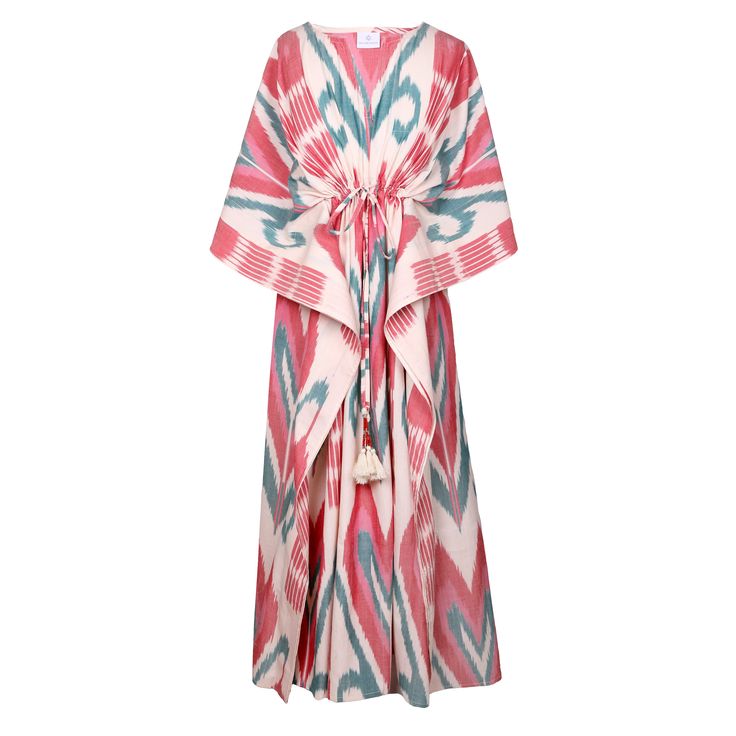 Our Cannes Cotton Ikat Maxi Kaftan dress is the perfect summer dress! This amazing fabric is completely handwoven with a combination of very fine cotton yarns, creating incredibly vibrant and beautiful colors. Ikat, meaning “to tie” or “to bind” in Indonesian, is an ancient dyeing technique involving the meticulous binding and dyeing of threads before weaving them into intricate patterns. To appreciate this artistry, Jean Marie, the founder of Pax Philomena, embarked on a special journey to the Multicolor Spring Kaftan With Back Tassel Tie-up, Summer Long Ikat Print Kaftan, Vibrant Cotton Beach Dress, Long Ikat Print Kaftan For Summer, Bohemian Multicolor Ikat Print Dress, Multicolor Ikat Print Maxi Dress For Beach, Multicolor Cotton Ikat Print Dress, Multicolor Ikat Print Cotton Dress, Bohemian Multicolor Kaftan With Back Tassel Tie-up