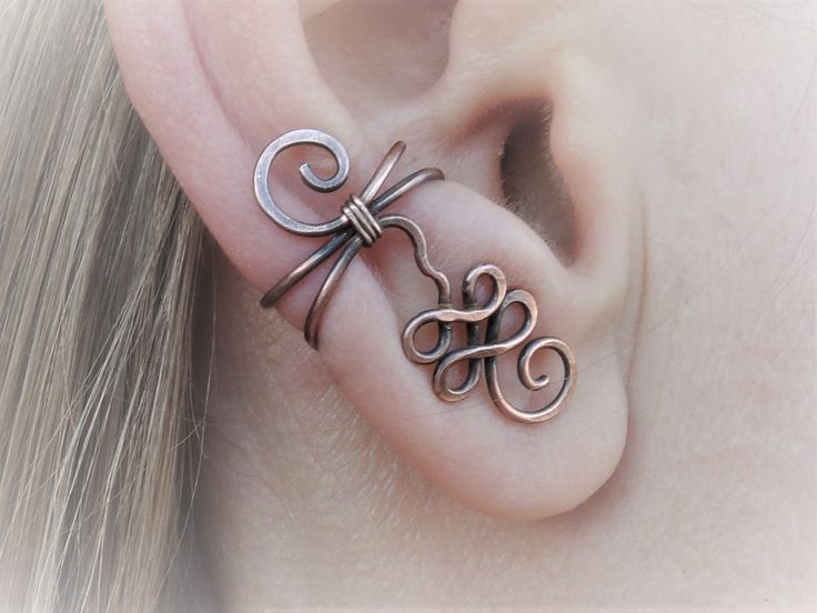 This unalome ear cuff will gracefully embellish the edge of your ear. Delicate looking spirals sweep up and down. MATERIALS / FINISH: - Copper bare (img. 3) or oxidized - aged antique look (img. 1, 2) - Sterling silver 925 bare (img. 4, 5) or oxidized with aged antique look (img. 6, 7) - Silver plated copper (img.10) - German silver (img. 8) - Brass (img. 9) You can choose to order a single earring or a matching pair. The earring is about 1.1 inches / 2.8 cm long. Totally handmade unique piece o Unique Adjustable Pierced Ear Climbers, Adjustable Unique Style Ear Climbers, Unique Adjustable Nickel-free Ear Climbers, Adjustable Spiral Ear Cuff, Unique Adjustable Pierced Ear Cuff, Adjustable Pierced Ear Climbers As Gift, Handmade Adjustable Ear Climbers, Adjustable Ear Climbers As A Gift, Unique Adjustable Metal Ear Climbers