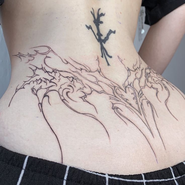 a woman with a tattoo on her back