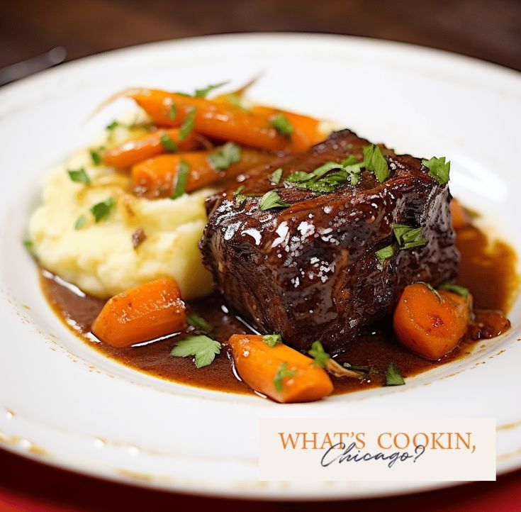 a white plate topped with meat and veggies covered in gravy next to mashed potatoes