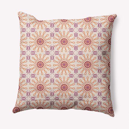 an orange and pink pillow on a white background with a pattern in the shape of flowers