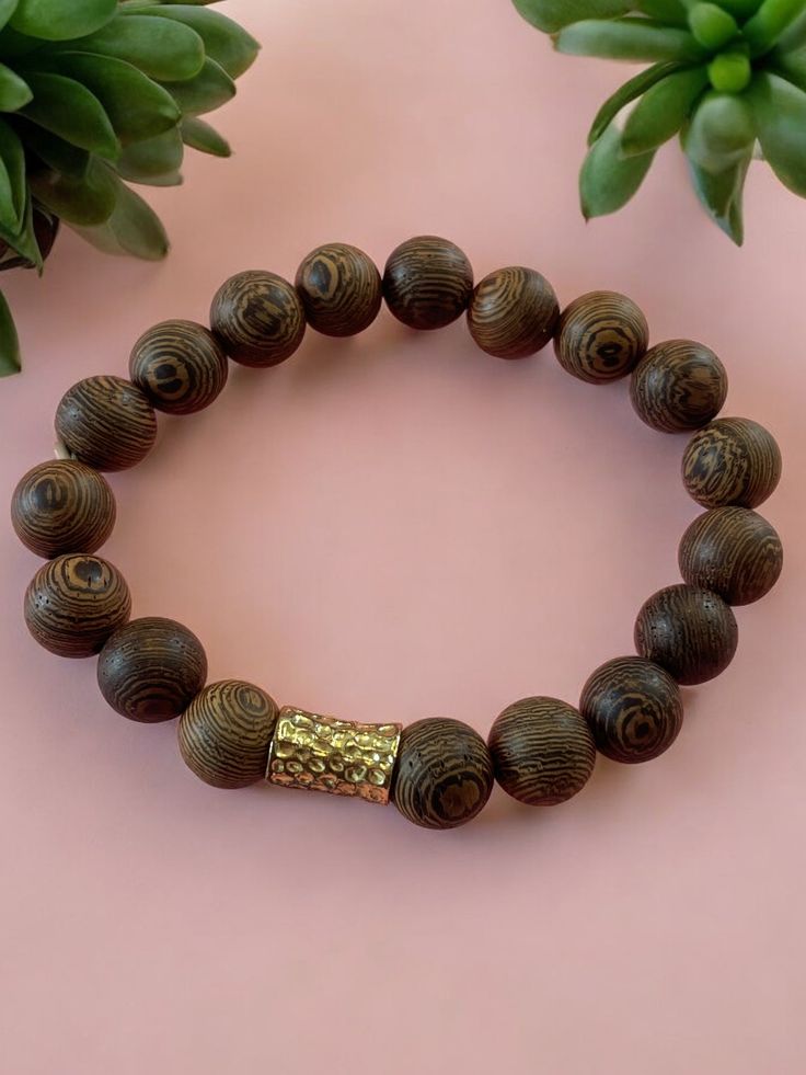 Gemstone Significance: Wood: Symbolizing growth, strength, and a deep connection to nature, wooden beads bring an earthy, grounding energy to your style. White Stone: Known for its purity and peace, white stone beads promote clarity and balance, adding a touch of serenity to your look. Versatile Style: The Wood Luck Bracelet Set effortlessly enhances any outfit with its natural elegance and refined charm. Perfect for daily wear, special events, or as a thoughtful gift, these bracelets offer styl Natural Wooden Beads Spiritual Bracelet, Holistic Wooden Beads Bracelets For Meditation, Holistic Wooden Beaded Bracelets For Meditation, Spiritual Wooden Beaded Bracelets, Nature-inspired Wooden Beaded Bracelets As Gift, Nature-inspired Wooden Beaded Bracelets For Gifts, Spiritual Natural Wood Beaded Bracelets, Handmade Wooden Beaded Bracelets For Meditation, Holistic Brown Bracelets For Meditation