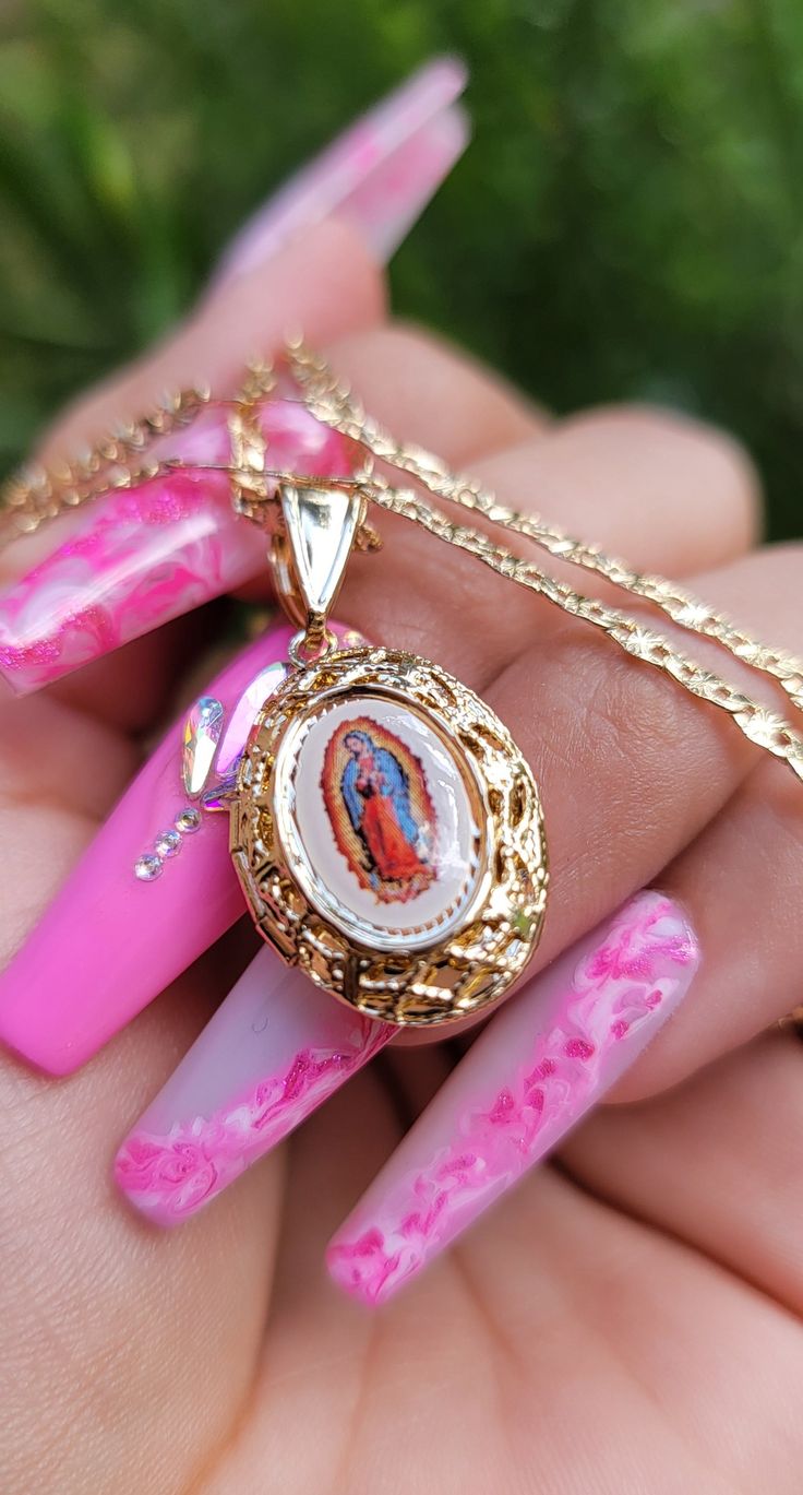 This beautiful "Strength" 18K Gold Plated Virgin Mary locket Necklace is the perfect reminder to stay strong throughout life's challenges. Shop this item today and unlock the divine strength within! Includes 18" inch chain Stackable necklace Pendant Height: Approx. 1.75" inch 14K gold plated Gold Spiritual Locket Necklace With Adjustable Chain, Spiritual Gold Locket Necklace With Adjustable Chain, Gold Spiritual Personalized Locket Necklace, Gold Spiritual Jewelry For Keepsake, Spiritual Our Lady Of Guadalupe Jewelry Gift, Our Lady Of Guadalupe Round Pendant As Gift, Gold Our Lady Of Guadalupe Necklace Gift, Stackable Necklaces, Mary Necklace