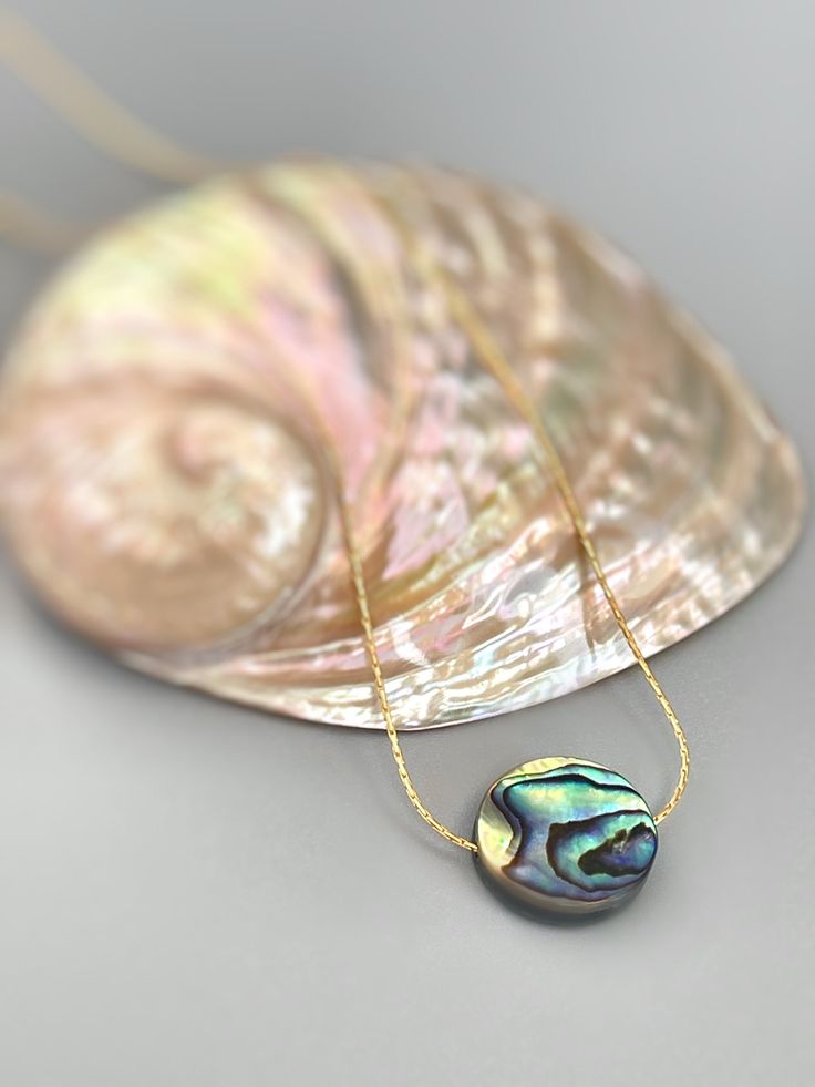 Handmade genuine Abalone necklace. A dainty solitaire necklace for women with an iridescent Abalone Shell on a delicate sterling silver or 14k gold filled  chain. Perfect summer or beach necklace. A simple, elegant  necklace perfect for everyday wear.  Gemstone size: 14mm tall x 14mm wide (approx 1/2") PLEASE note measurements and size reference pictures. Our jewelry and hair accessories are photographed close up to show detail and may appear larger than they are. We are happy to help with any q Klimt Jewelry, Simple Elegant Necklace, Forest Jewelry, Abalone Jewelry, Abalone Shell Necklace, Soldered Jewelry, Sunstone Jewelry, Abalone Necklace, Handmade Mermaid