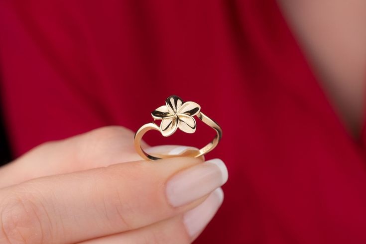 Our dainty flower ring is 14k solid gold. It has a minimalist and dainty style, you can use it everyday. At the top, it has dainty five leaf flower that looks fascinating.  When you think of this dainty flower ring as a gift for your loved ones, it will be a great gift choice. Our gold ring makes happy your loved ones on their birthdays, graduations, anniversaries, mother's day, valentine's day, or women's day and also as a Christmas Gift! :) 🎁 If you want, you can add a gift note for your loved ones. It arrives in a special jewelry gift box. ✨ We respond to your questions happily. Your question will be answered within 24 hours. Do not hesitate to contact us. 💎 I hope you have a lot of Onseva's designs. :) a.b. Elegant 14k Gold Flower Ring, Minimalist Flower Jewelry For Promise, Minimalist Flower-shaped Promise Jewelry, Minimalist Yellow Gold Flower Ring, Tiny Elegant Flower Ring For Weddings, Elegant Tiny Flower Jewelry, Elegant Tiny Flower-shaped Jewelry, Tiny Elegant Flower-shaped Jewelry, Elegant Tiny Flower Shaped Jewelry